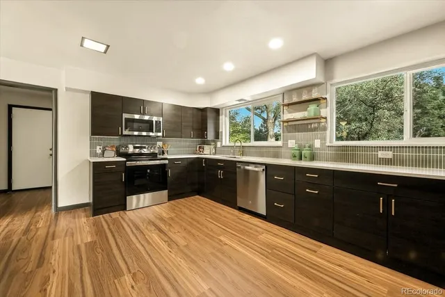 a view of en suite bathroom with a sink and a mirror