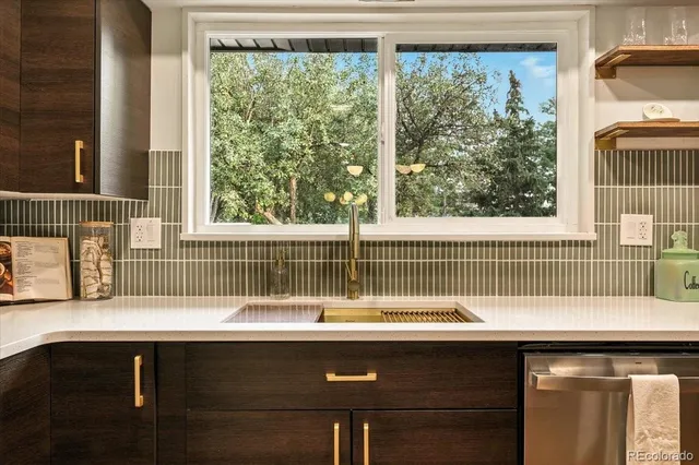 a kitchen with a refrigerator and a sink