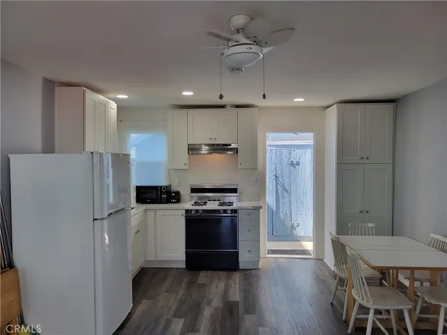 a view of bathroom with a toilet sink and mirror