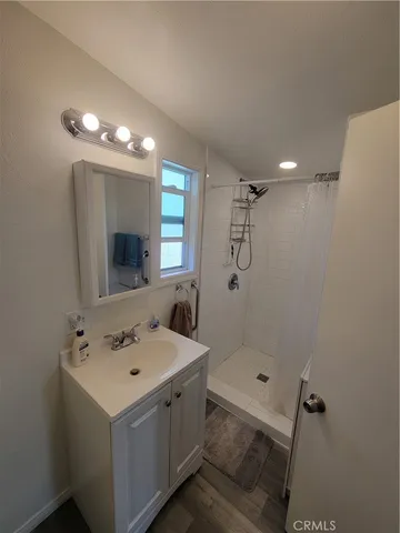 a kitchen with a white stove top oven and refrigerator