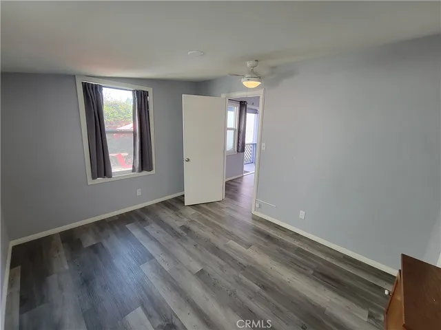 a kitchen with cabinets and window