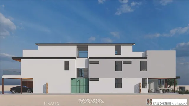 a view of a house with a yard and potted plants