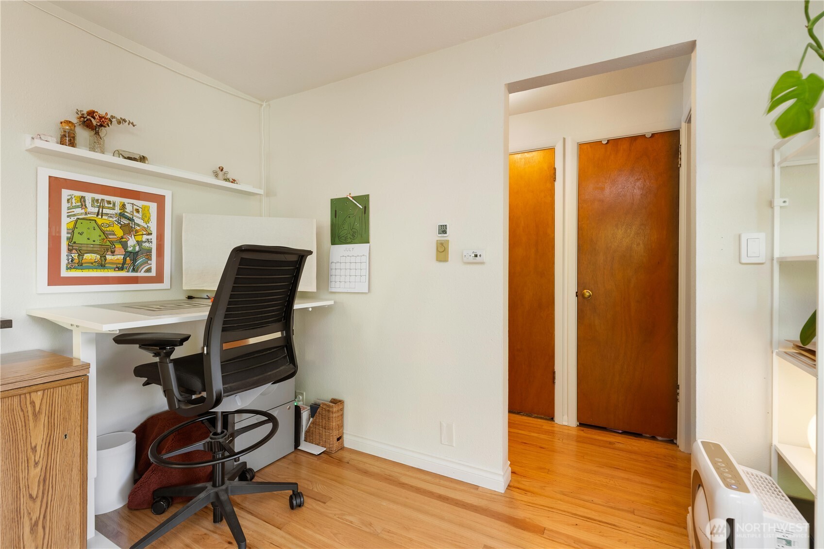 7343 35th Avenue Southwest Seattle, WA 98126 - Photo 13 of 36 a view of a workspace with furniture and a window
