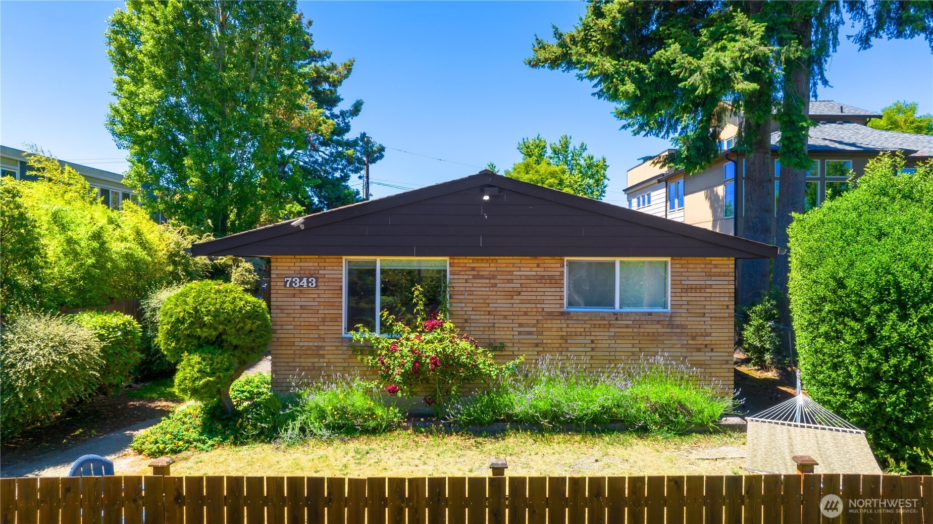 7343 35th Avenue Southwest Seattle, WA 98126 - Photo 2 of 36 a front view of a house with a yard