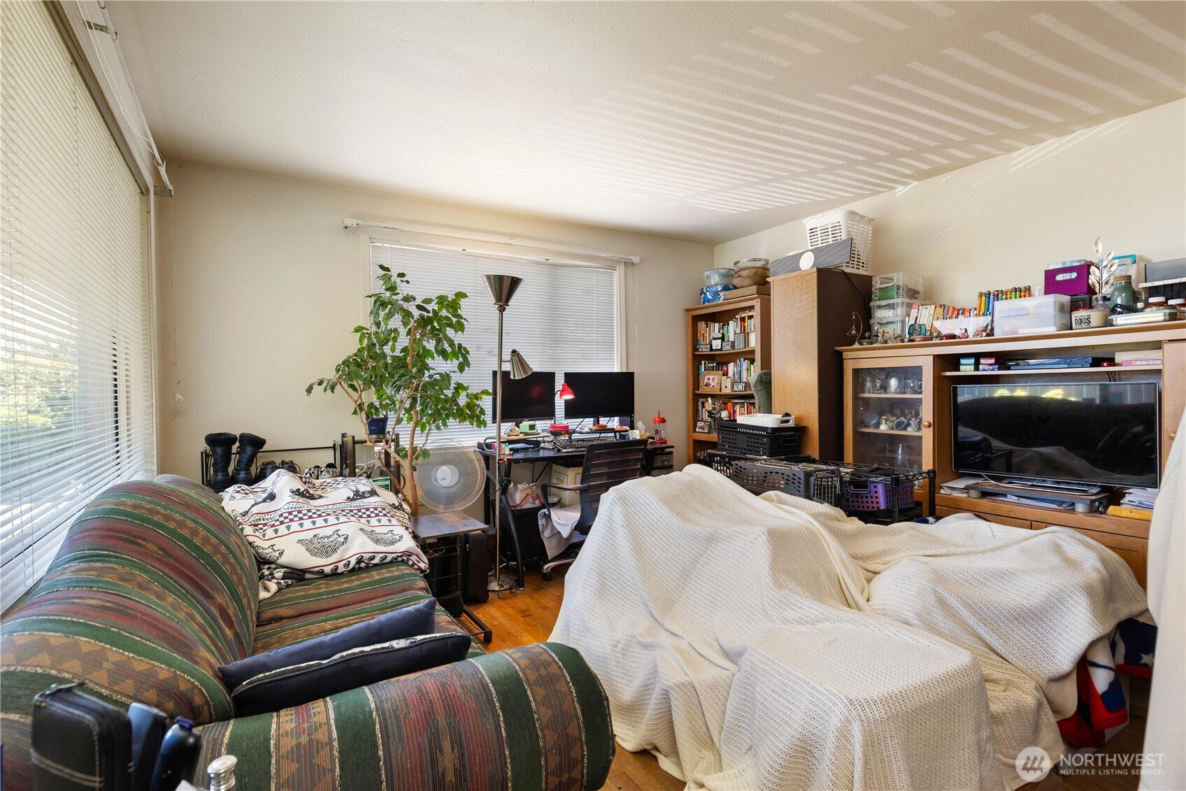 7343 35th Avenue Southwest Seattle, WA 98126 - Photo 22 of 36 a bedroom with furniture and a flat screen tv