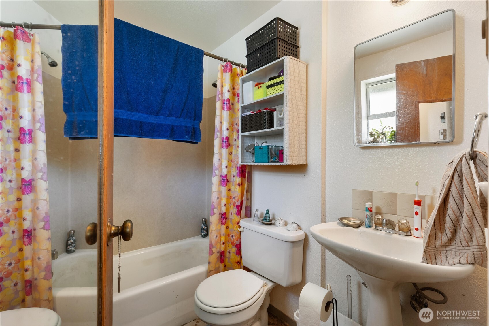 7343 35th Avenue Southwest Seattle, WA 98126 - Photo 25 of 36 a bathroom with a sink toilet and shower