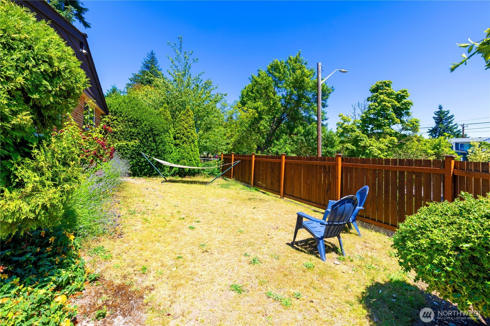 7343 35th Avenue Southwest Seattle, WA 98126 - Photo 29 of 36 a backyard of a house with table and chairs