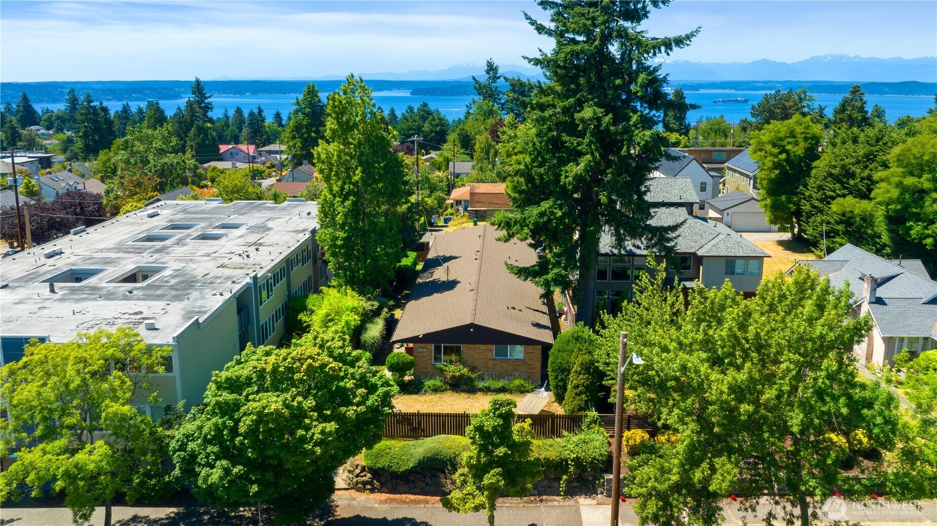 7343 35th Avenue Southwest Seattle, WA 98126 - Photo 3 of 36 an aerial view of a house with a yard and lake view