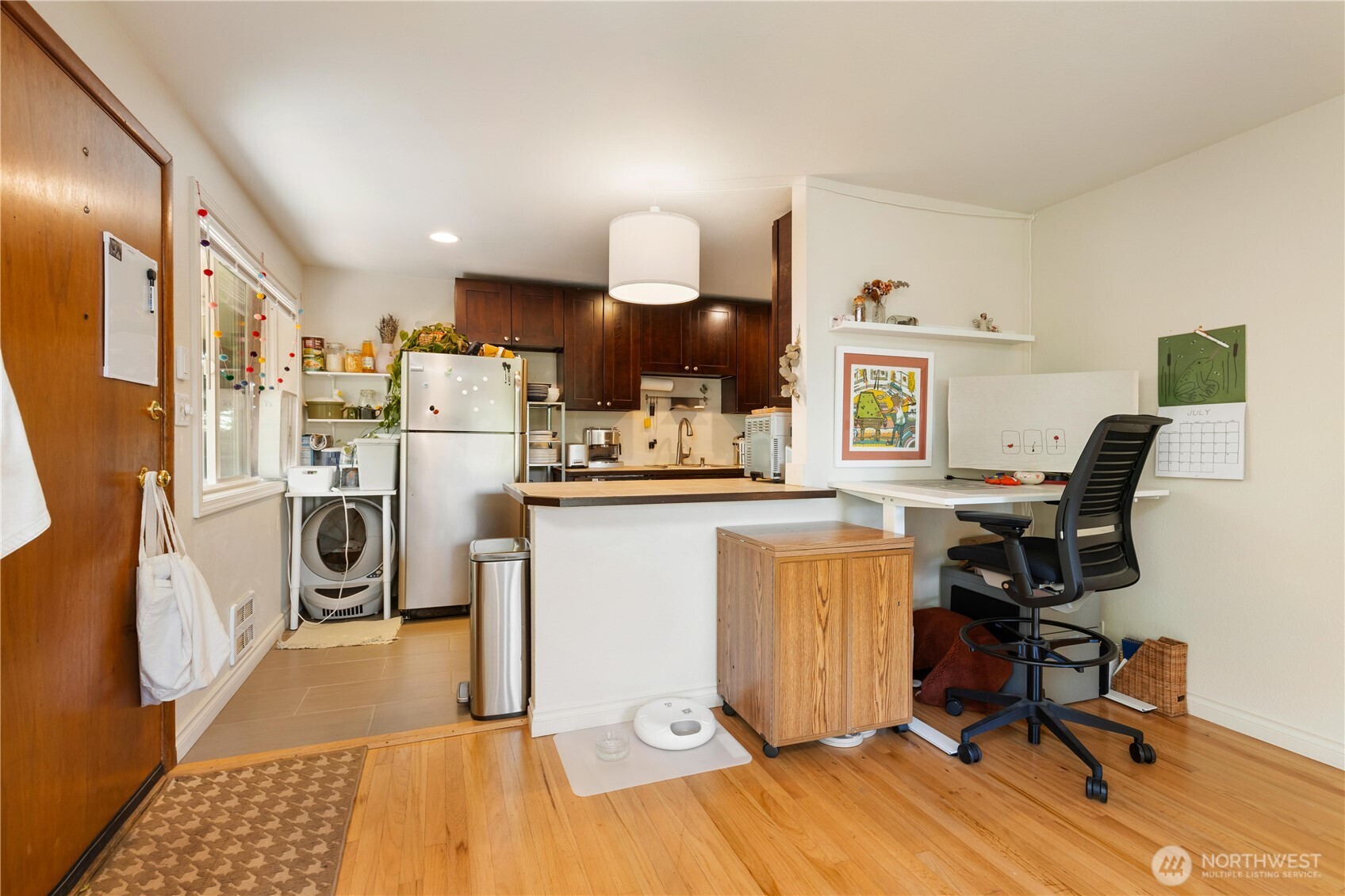 7343 35th Avenue Southwest Seattle, WA 98126 - Photo 10 of 36 a view of a kitchen with fridge and workspace
