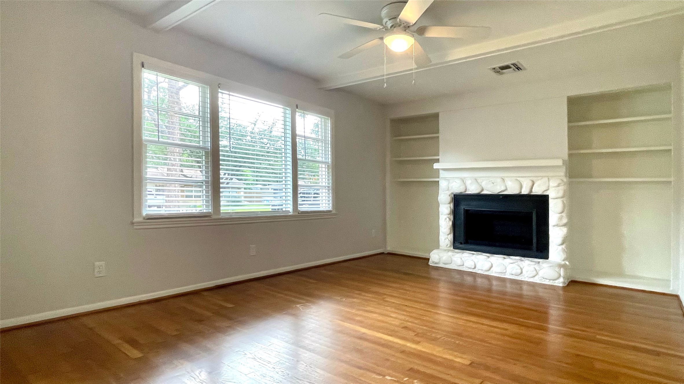 5905 Darnell Street Houston, TX 77074 - Photo 15 of 34 a view of an empty room with wooden floor and a window