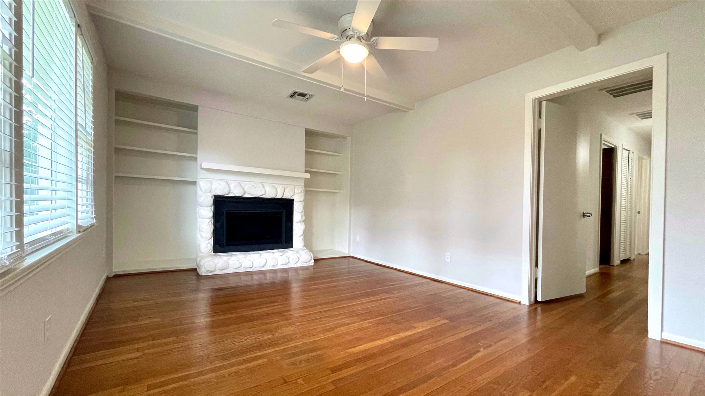 5905 Darnell Street Houston, TX 77074 - Photo 16 of 34 a view of an empty room with wooden floor and a window