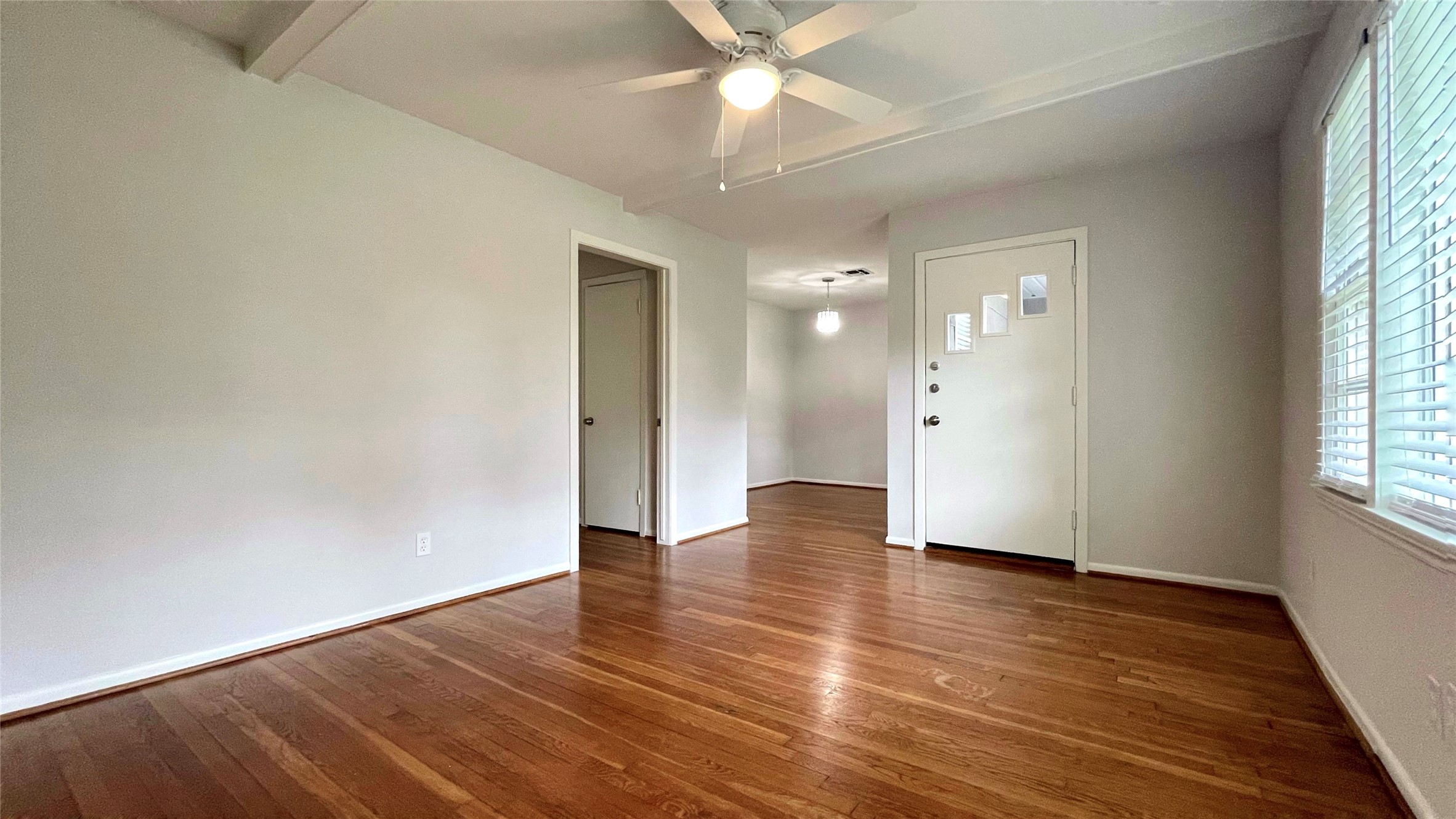 5905 Darnell Street Houston, TX 77074 - Photo 17 of 34 an empty room with wooden floor and windows