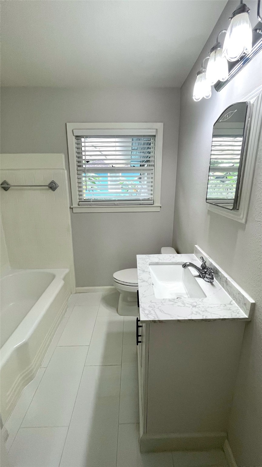 5905 Darnell Street Houston, TX 77074 - Photo 22 of 34 a bathroom with a sink and a mirror