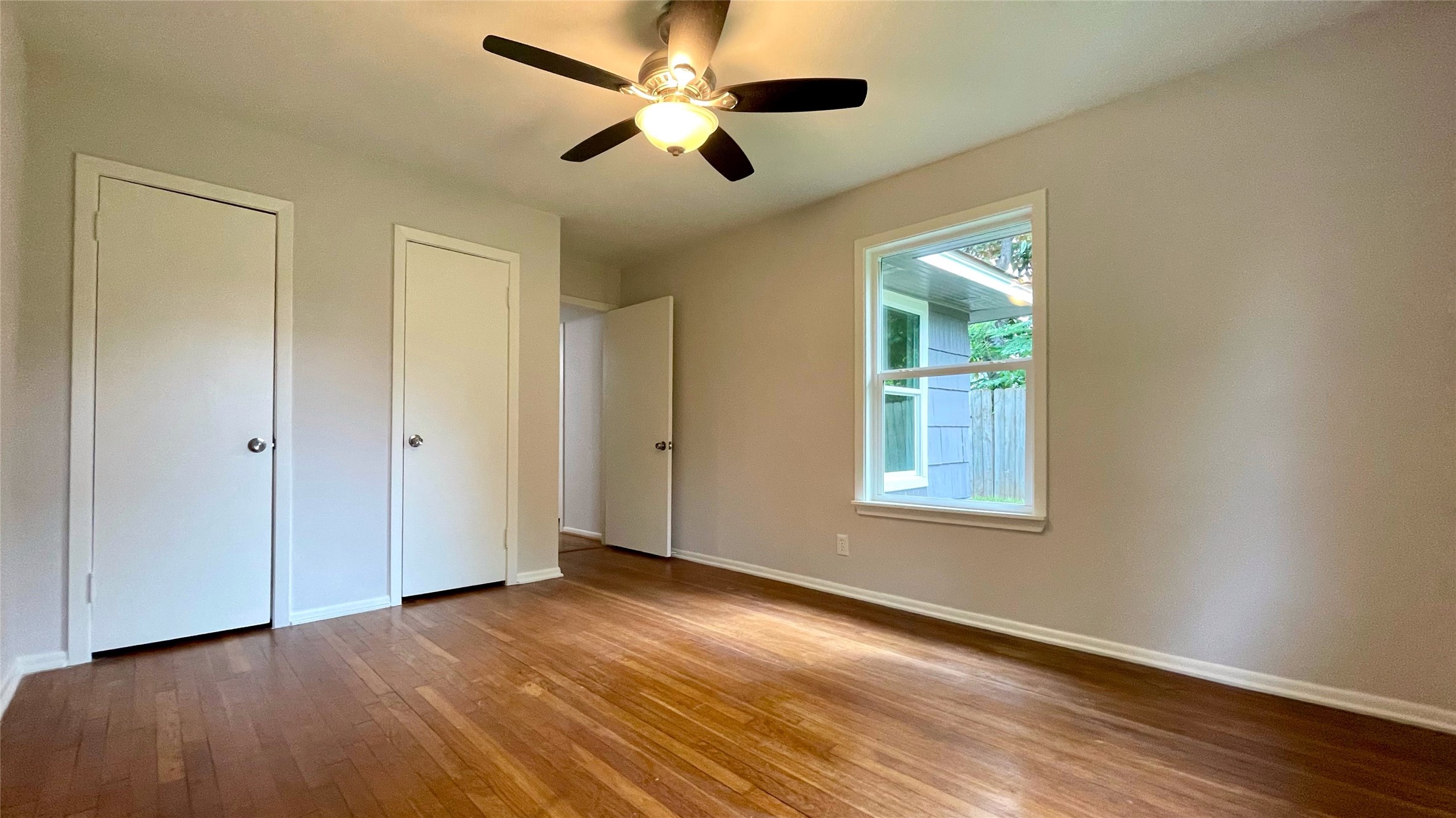 5905 Darnell Street Houston, TX 77074 - Photo 24 of 34 a view of an empty room with wooden floor and a window