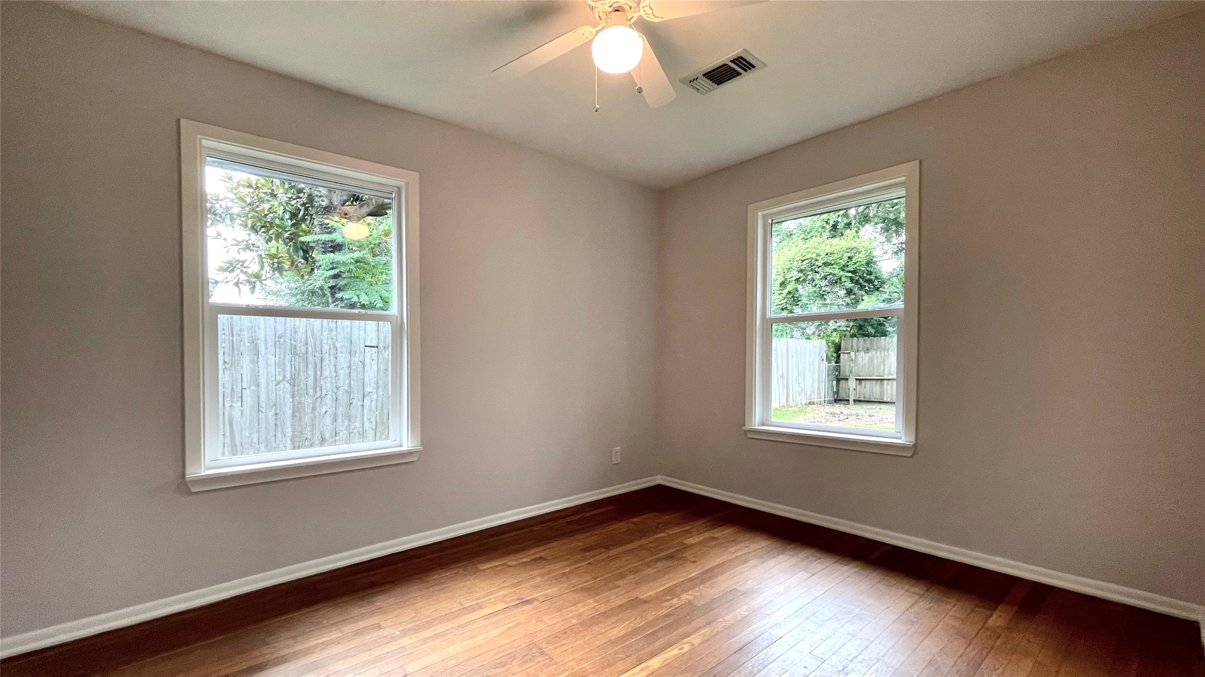 5905 Darnell Street Houston, TX 77074 - Photo 26 of 34 a view of an empty room with wooden floor and a window