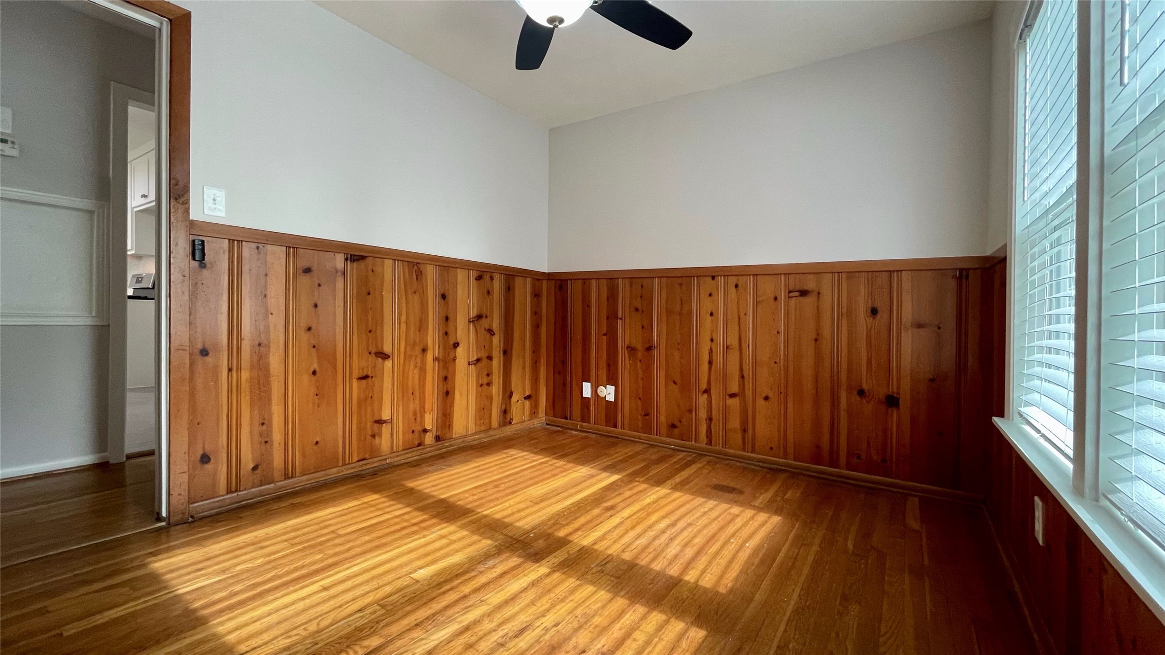 5905 Darnell Street Houston, TX 77074 - Photo 30 of 34 a view of an empty room with wooden floor and a window