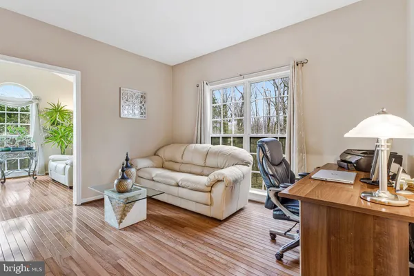 a living room with furniture and a table