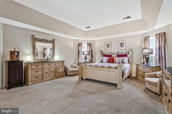 a bed room with furniture and a window