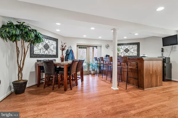 a view of a dining area with furniture window and wooden floor