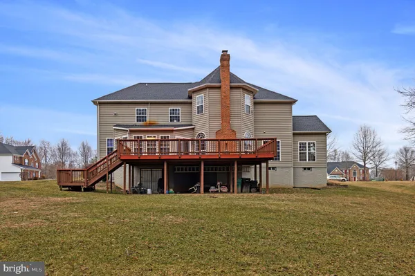 a view of a backyard with large trees