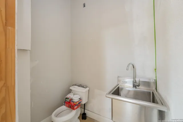 a bathroom with a sink and toilet