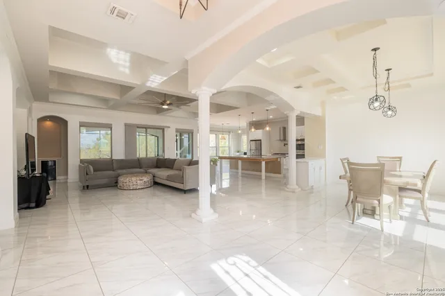 a lobby with furniture and a dining table