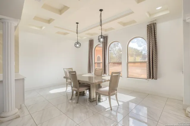 a view of a dining room with furniture window and outside view