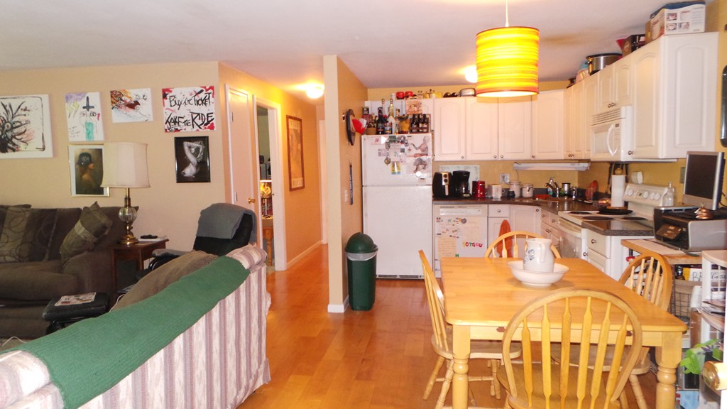 165 R Chestnut Street, Unit 8 Foxboro, MA 02035 - Photo 2 of 11 a living room with furniture and a table