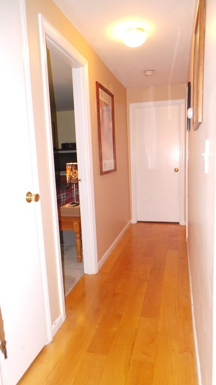 165 R Chestnut Street, Unit 8 Foxboro, MA 02035 - Photo 7 of 11 a view of hallway with bathroom and mirror