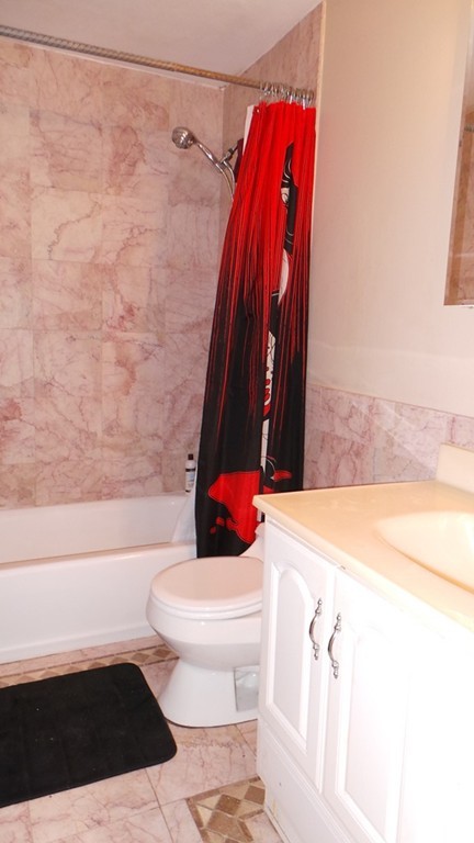 165 R Chestnut Street, Unit 8 Foxboro, MA 02035 - Photo 10 of 11 a bathroom with a toilet and a shower