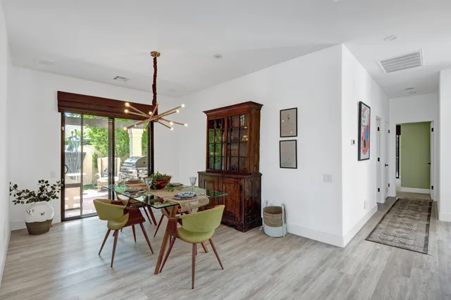 a dining room with furniture window wooden floor
