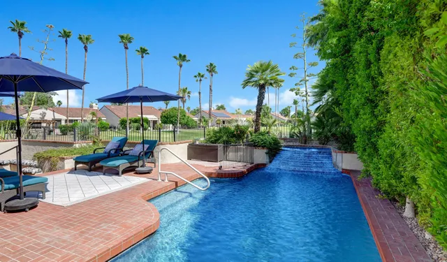 a view of a backyard with sitting area