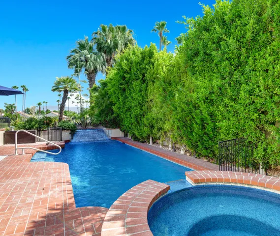a view of a swimming pool with a patio