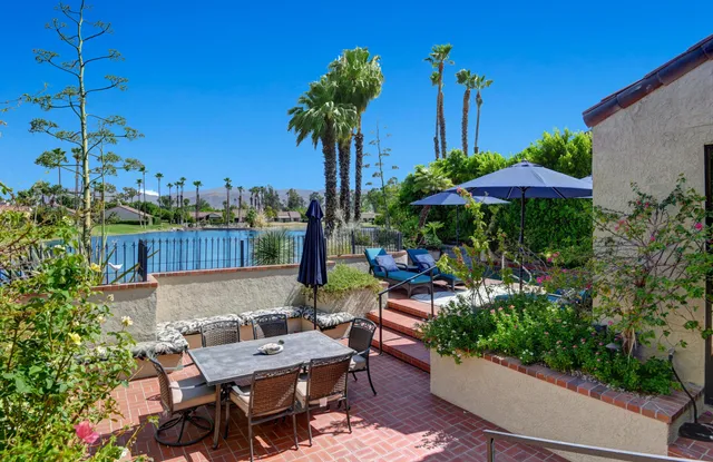 a view of a patio with furniture and a potted plants