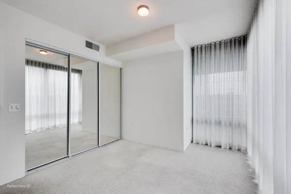 an empty room with a empty space and a window