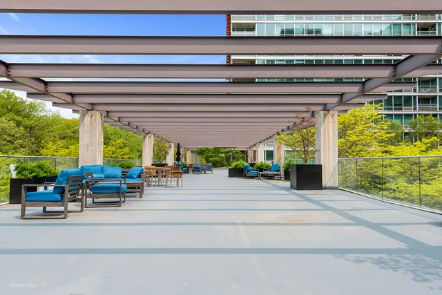 a building outdoor space with patio furniture and potted plants