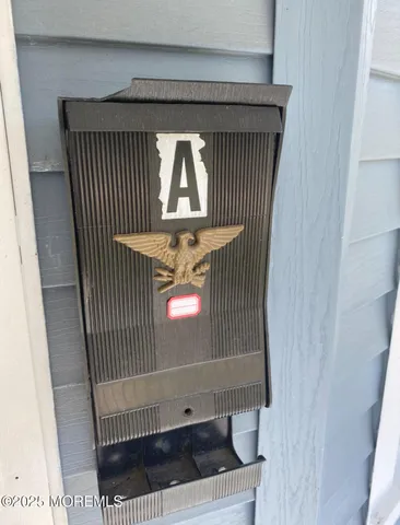 a view of a room with wooden floor and chair