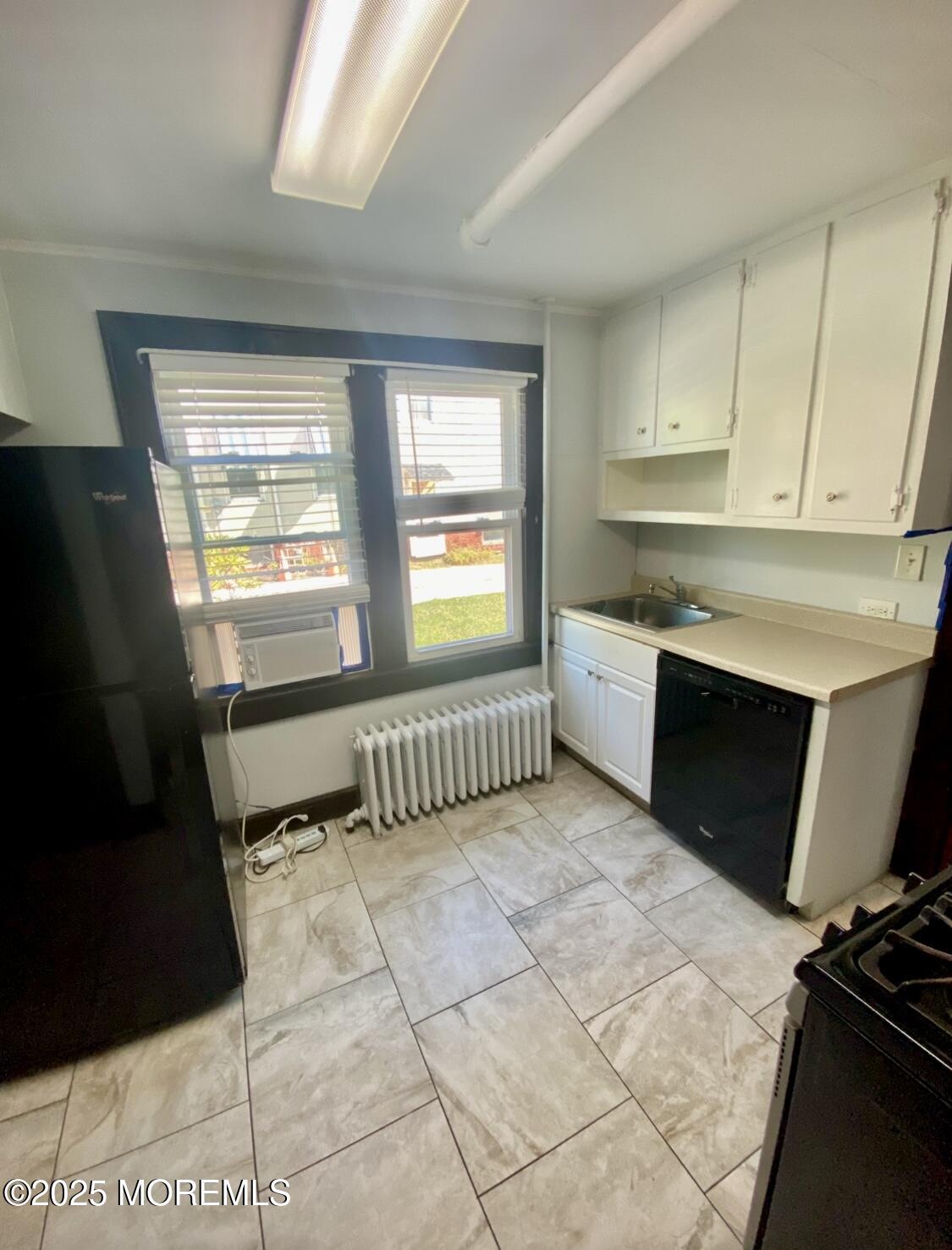 309 Hume Street Allenhurst, NJ 07711 - Photo 10 of 77 a kitchen with granite countertop a stove a sink and a microwave