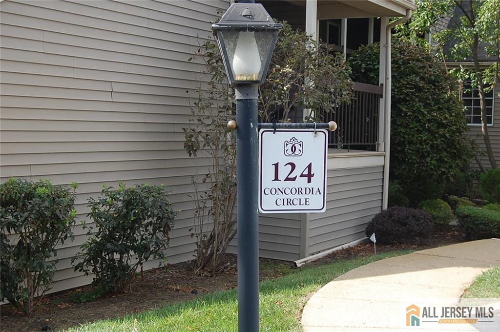 124 Concordia Circle, Unit 124C Monroe Township, NJ 08831 - Photo 1 of 21 a sign that is on the side of a building