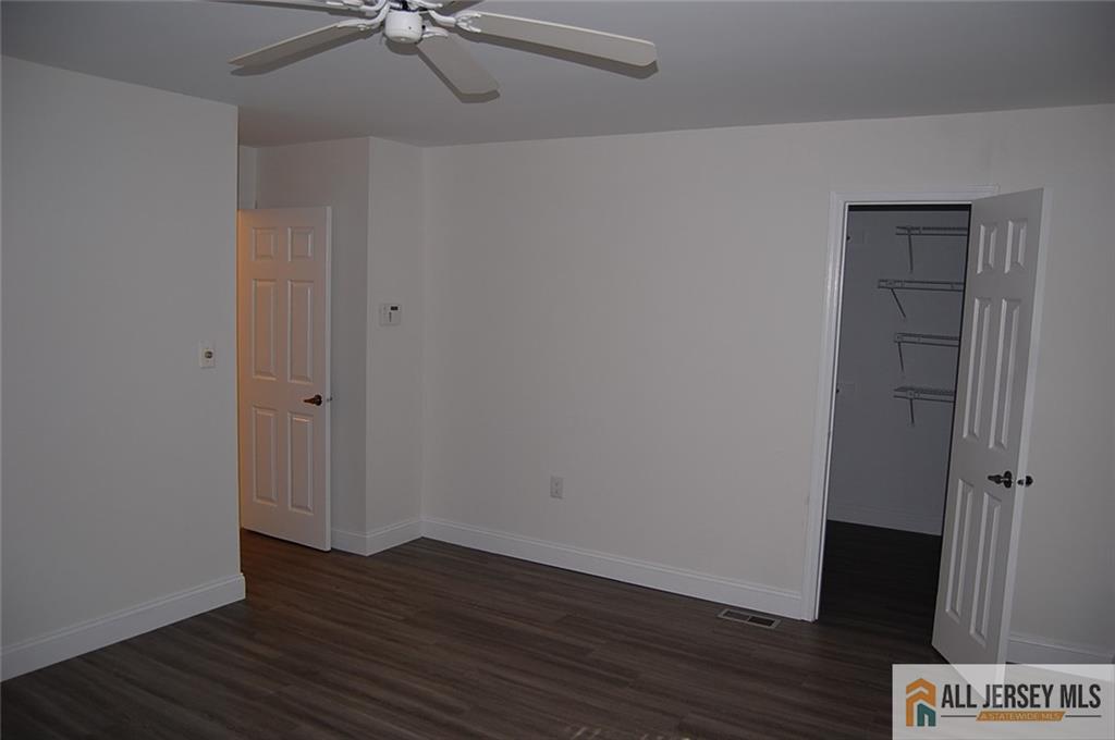 124 Concordia Circle, Unit 124C Monroe Township, NJ 08831 - Photo 13 of 21 wooden floor in an empty room