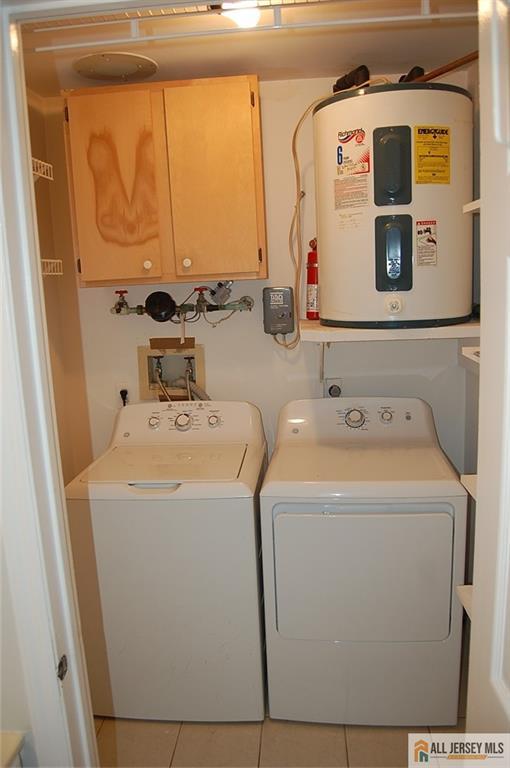 124 Concordia Circle, Unit 124C Monroe Township, NJ 08831 - Photo 17 of 21 a utility room with dryer and washer