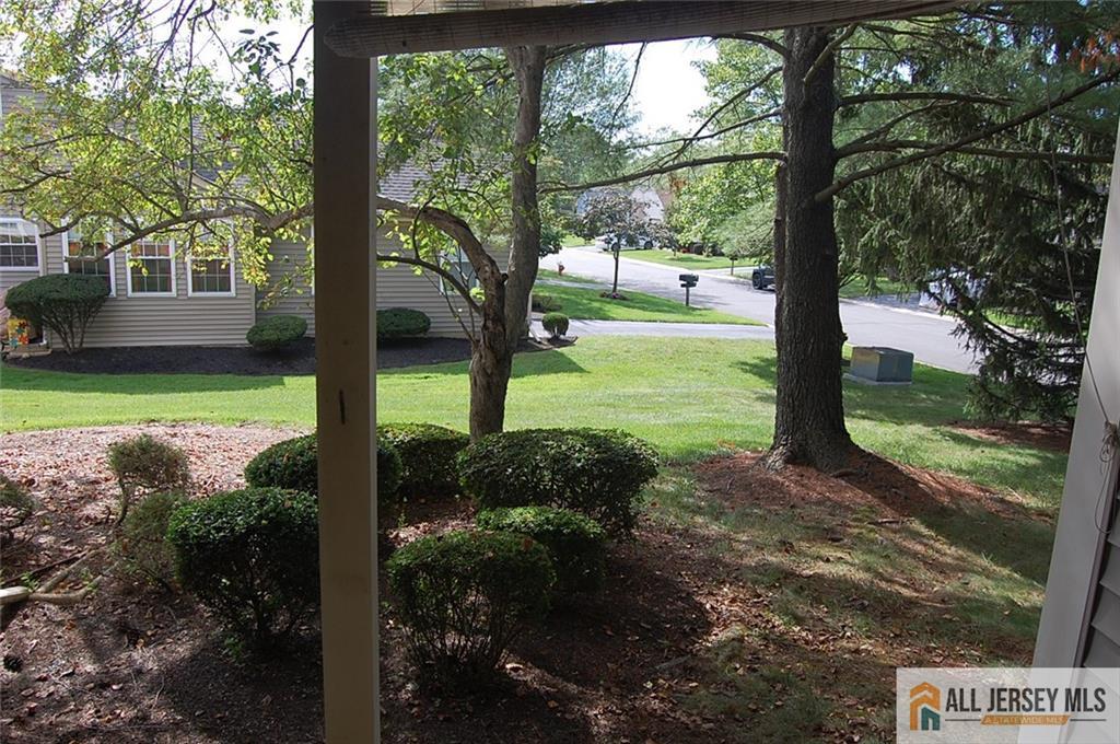 124 Concordia Circle, Unit 124C Monroe Township, NJ 08831 - Photo 19 of 21 a view of a yard with a tree