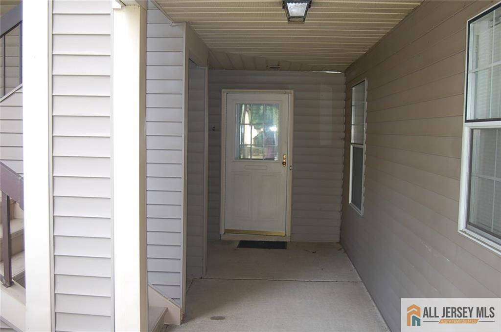 124 Concordia Circle, Unit 124C Monroe Township, NJ 08831 - Photo 3 of 21 a view of entryway with a white walls