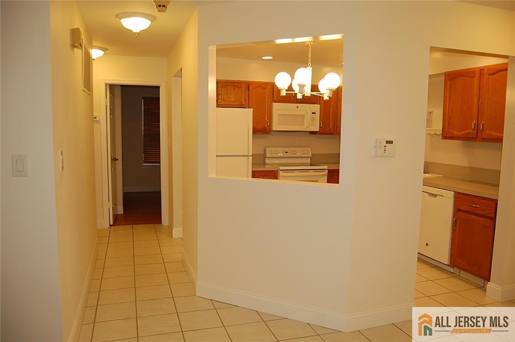 124 Concordia Circle, Unit 124C Monroe Township, NJ 08831 - Photo 9 of 21 a bathroom with a mirror