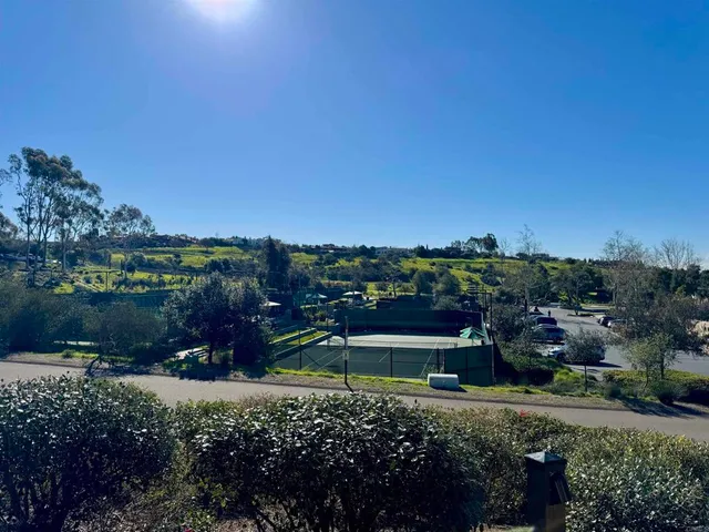 a large body of water with a building in the background