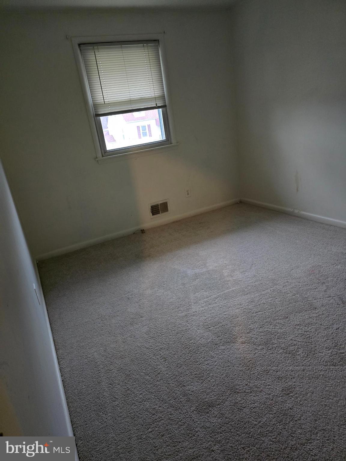 8305 Karl Avenue Rosedale, MD 21237 - Photo 5 of 13 a view of an empty room with a window