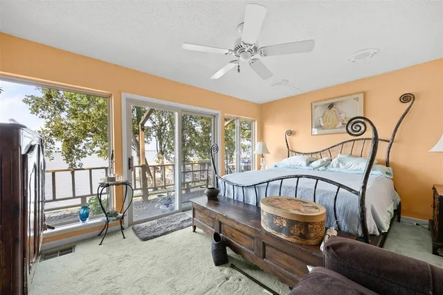 a view of a room with gym equipment and large windows