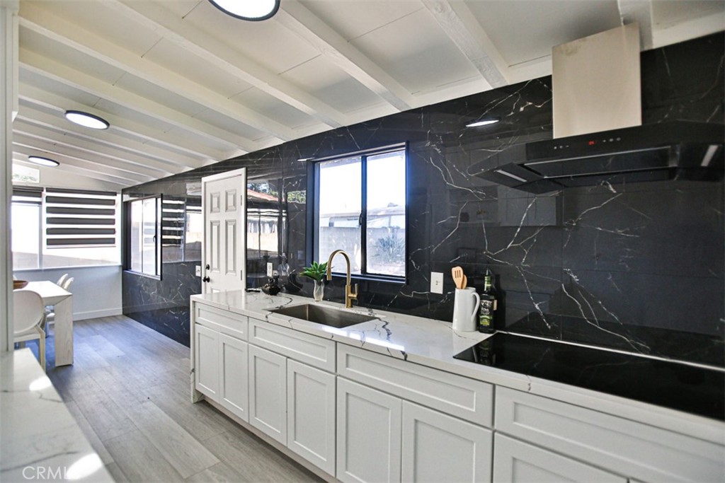2540 West Picadilly Way Anaheim, CA 92801 - Photo 13 of 37 a kitchen with sink and cabinets