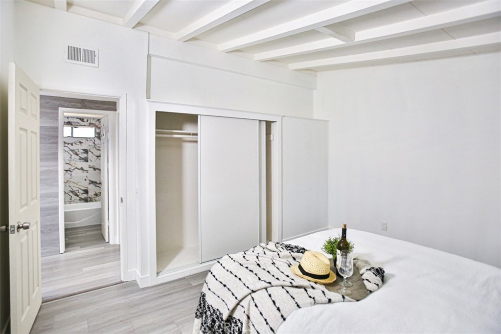 2540 West Picadilly Way Anaheim, CA 92801 - Photo 23 of 37 a bedroom with a bed and a table