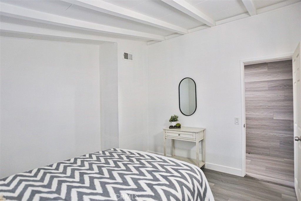 2540 West Picadilly Way Anaheim, CA 92801 - Photo 26 of 37 a bedroom with a bed and a table